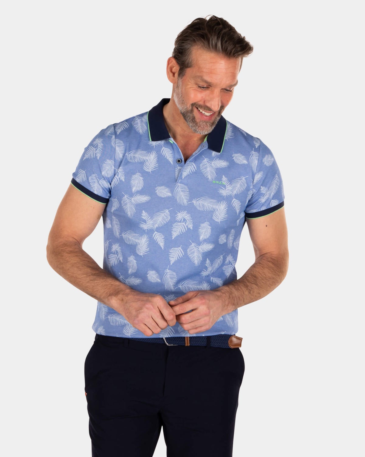 Polo bleu imprimé feuilles