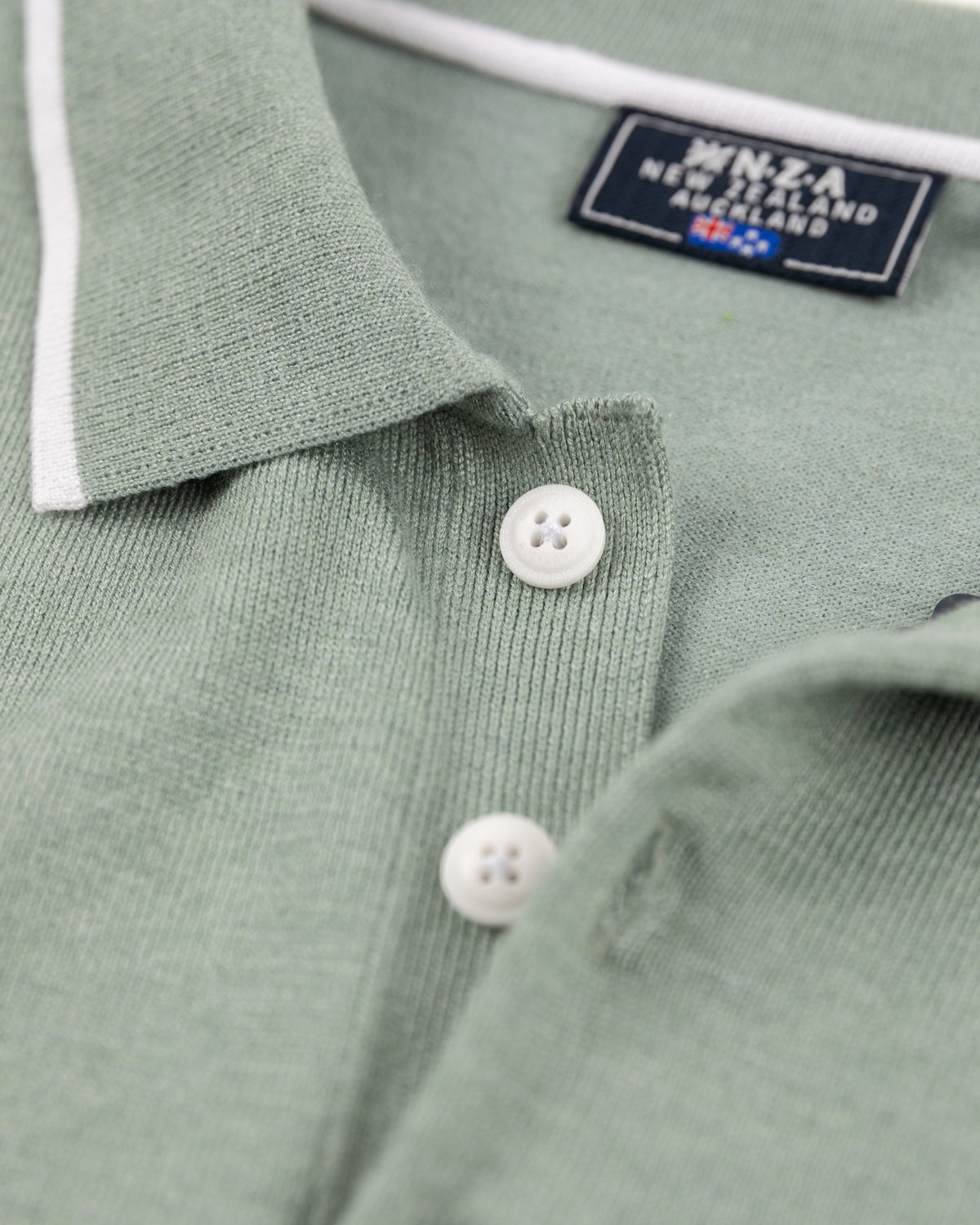 Green polo with white details - Sage