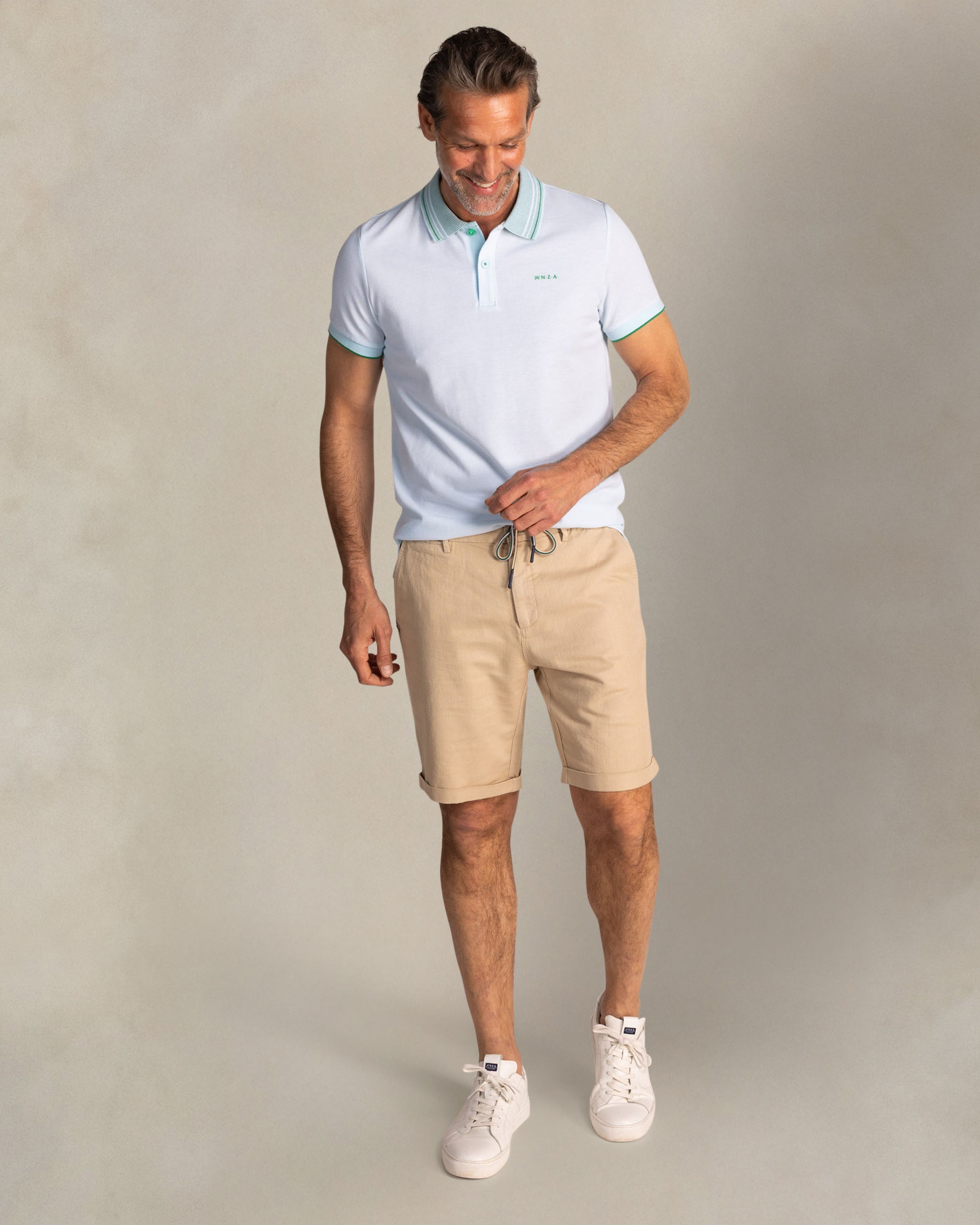 Light blue polo with striped collar Light blue polo with striped collar