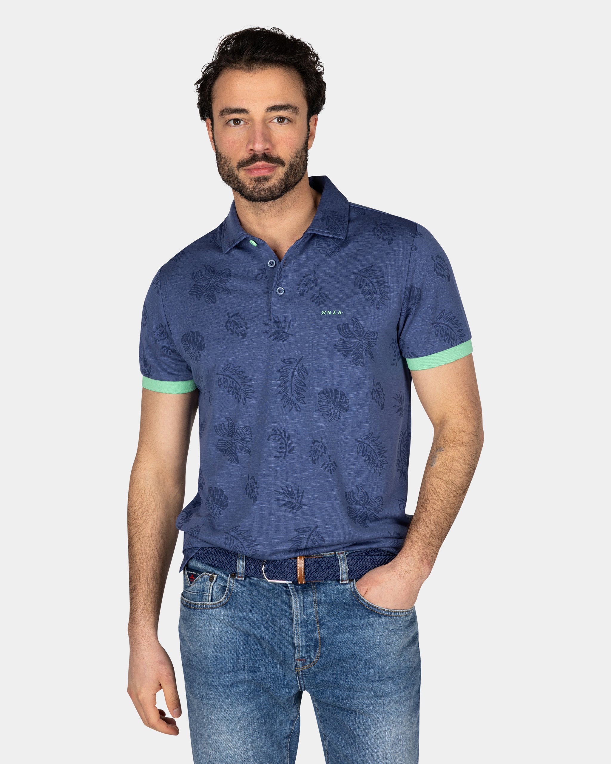 Blauw poloshirt met bladprint Blauw poloshirt met bladprint