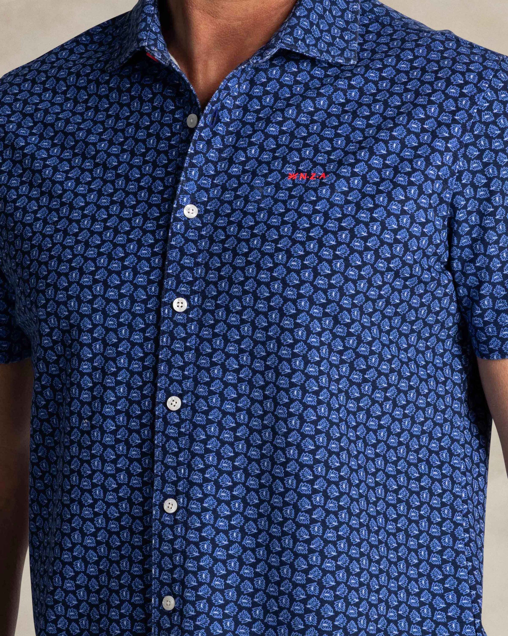 Blue shirt with small white dots Blue shirt with small white dots