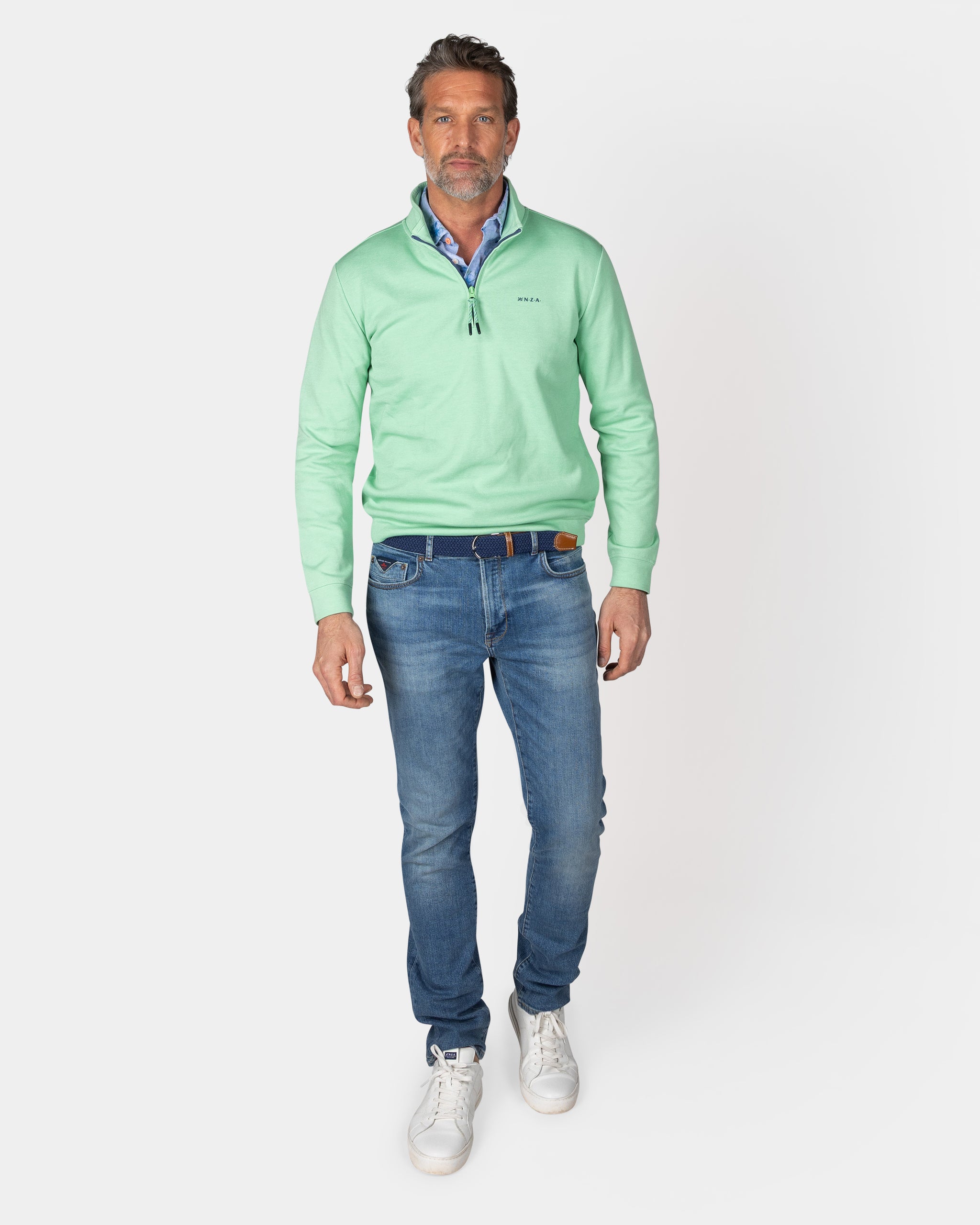 Suéter verde claro con cremallera media Suéter verde claro con cremallera media