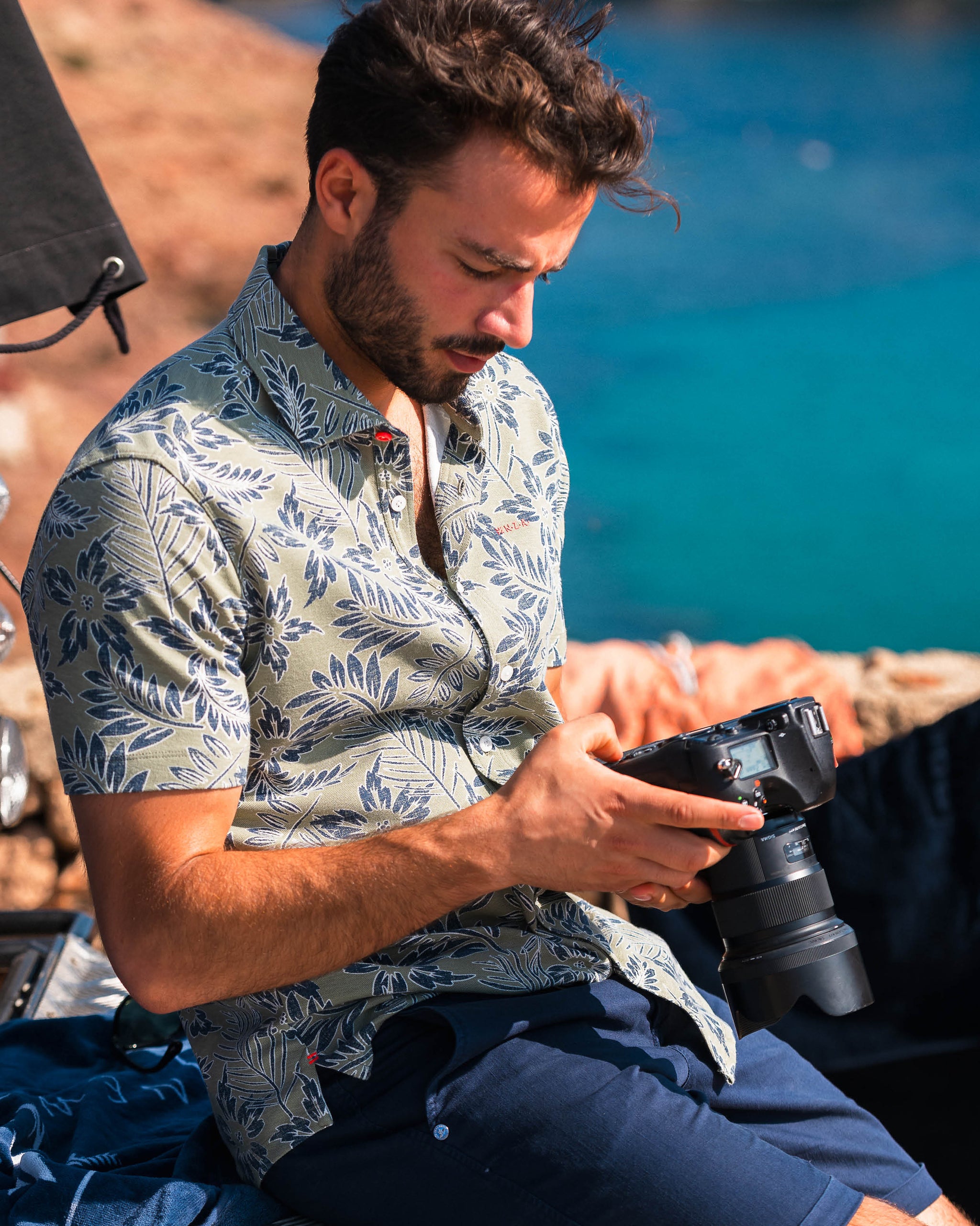 Green shirt with blue and white leaf print Green shirt with blue and white leaf print