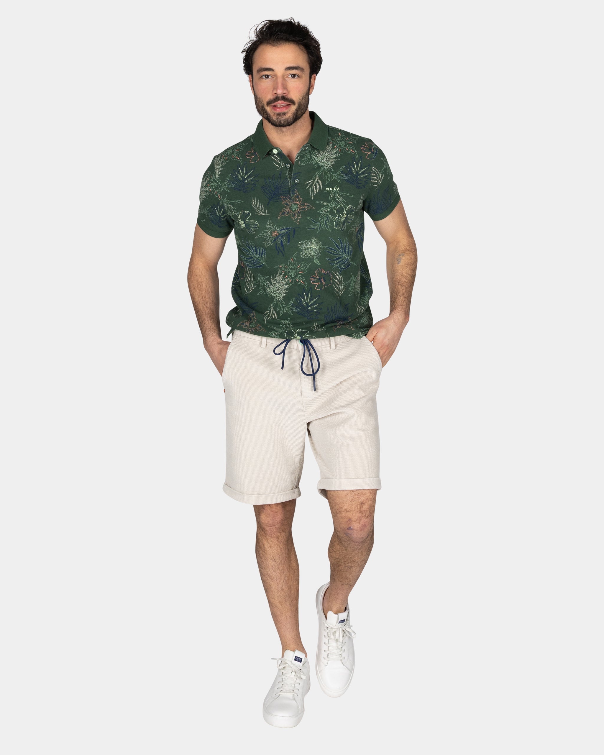 Katoenen groene polo met bladprint Katoenen groene polo met bladprint
