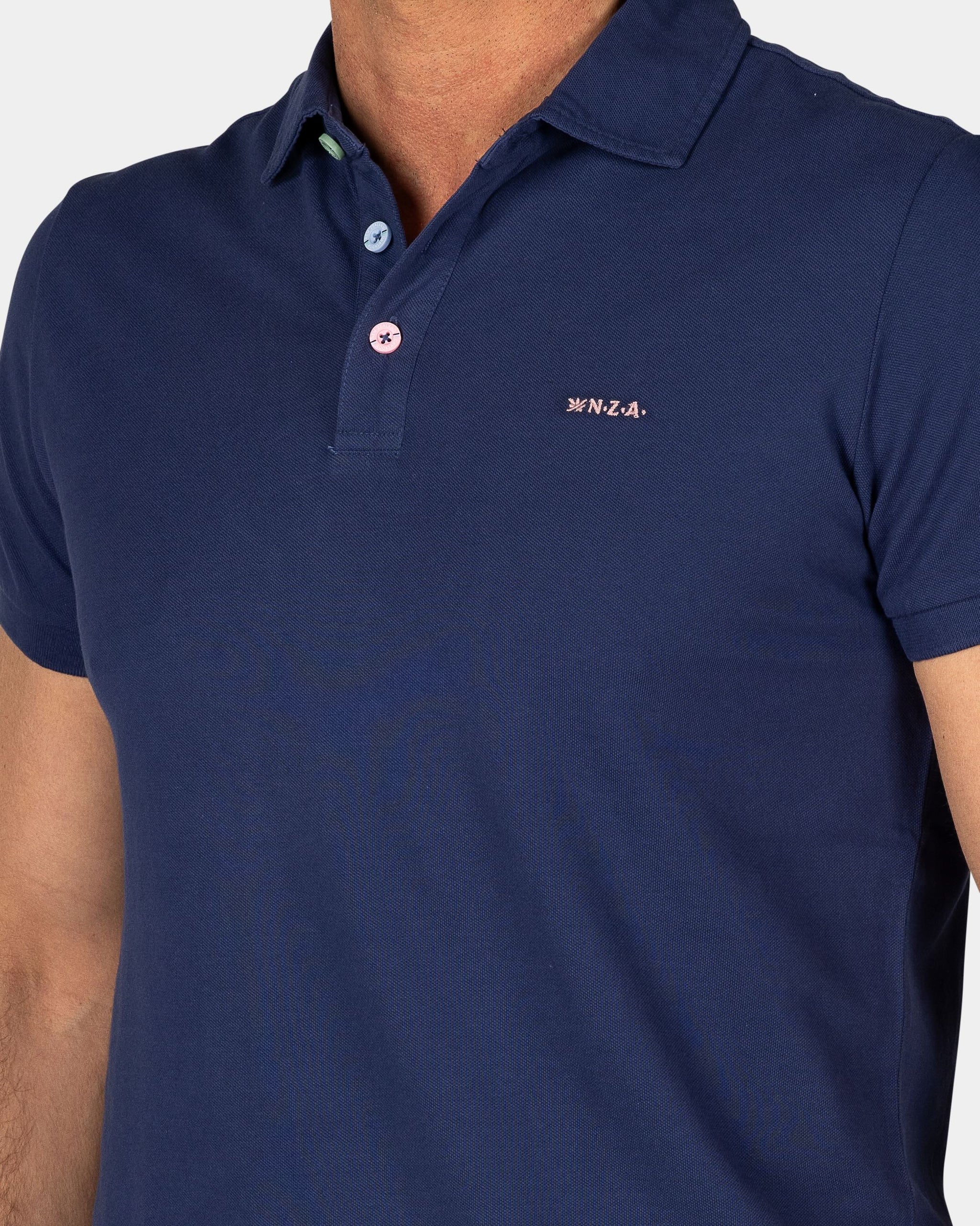 Polo uni en coton bleu Polo uni en coton bleu