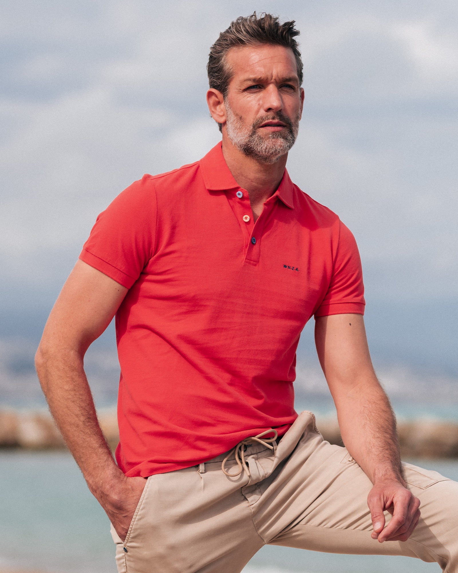 Einfarbige Baumwoll-Rotorange Polo Einfarbige Baumwoll-Rotorange Polo