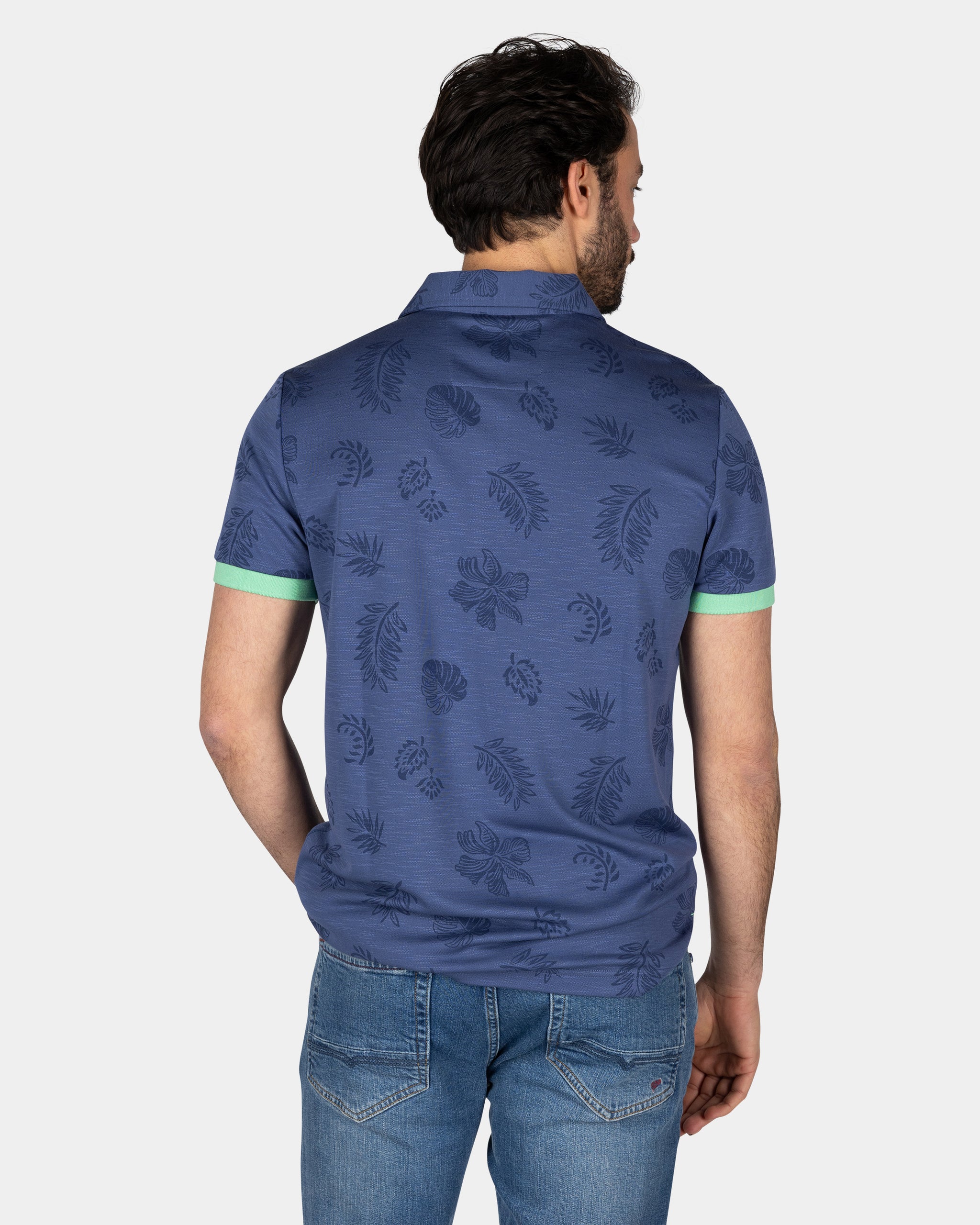 Blauw poloshirt met bladprint Blauw poloshirt met bladprint