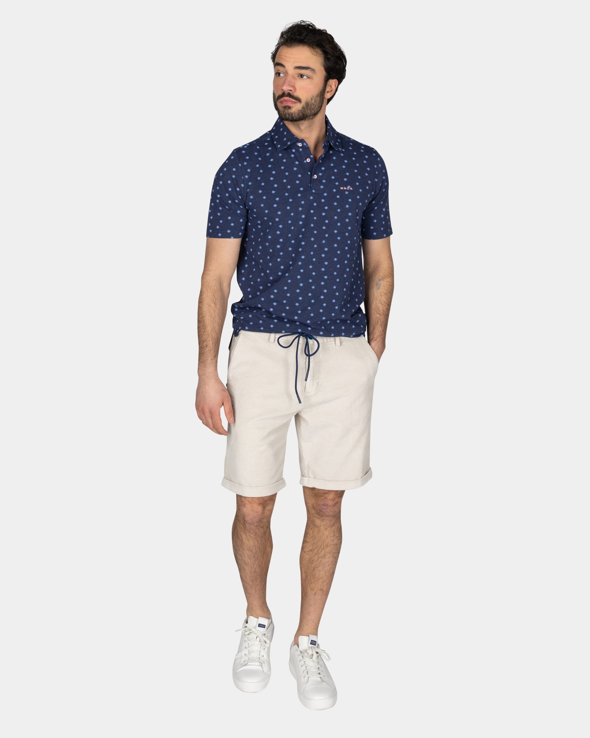 Cotton Blue Polo with a print of small polka dots Cotton Blue Polo with a print of small polka dots