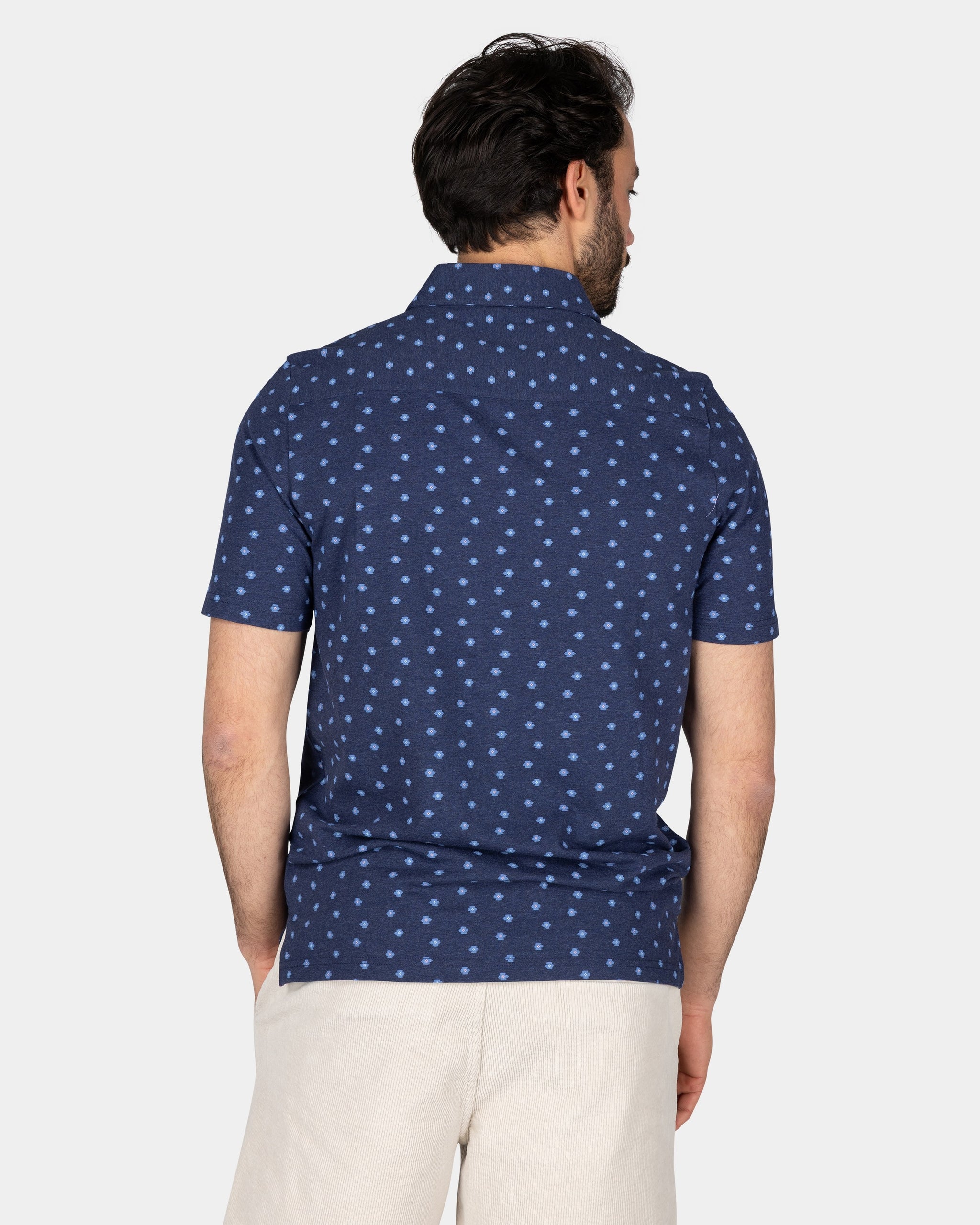 Cotton Blue Polo with a print of small polka dots Cotton Blue Polo with a print of small polka dots