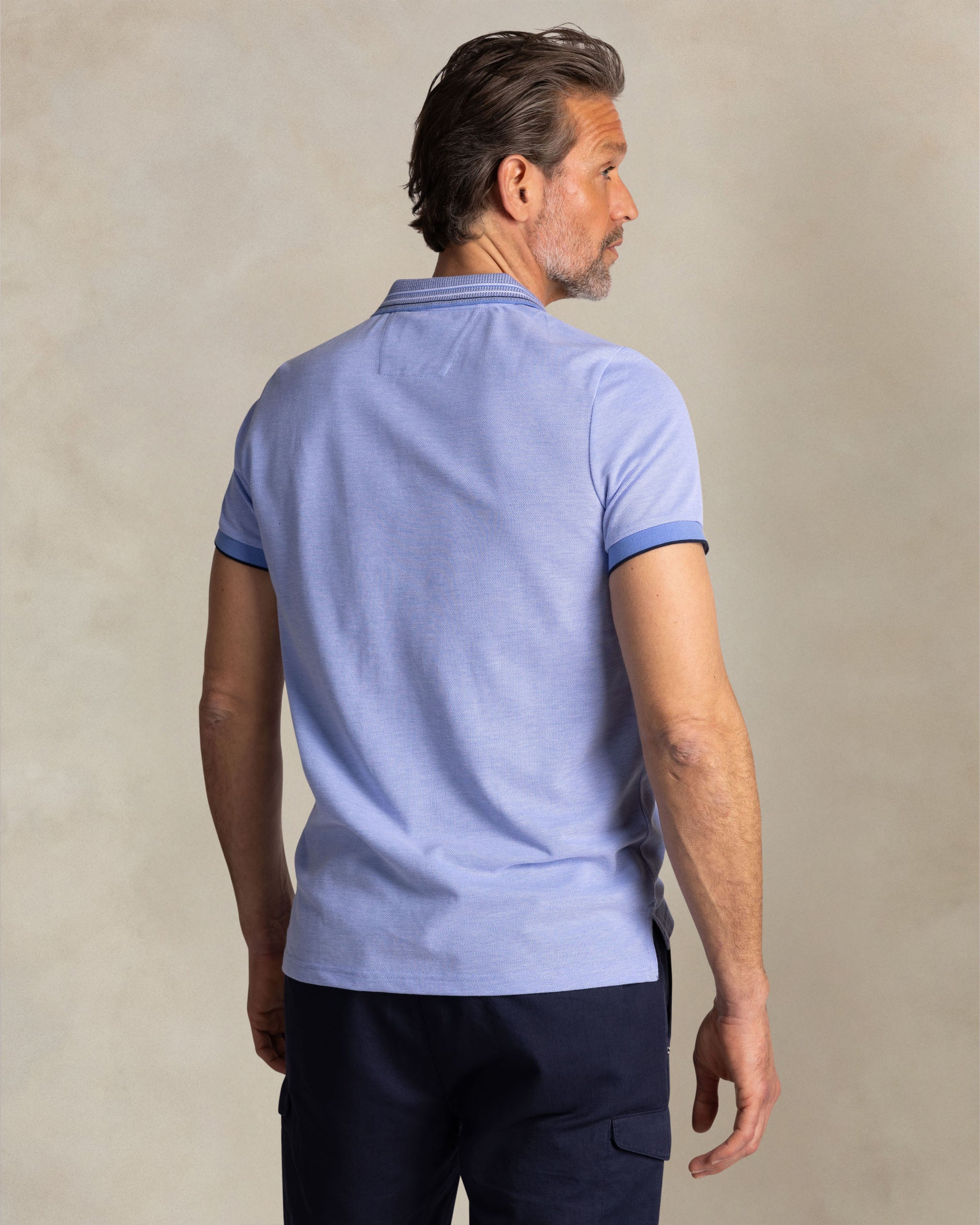 Bright blue polo with striped collar Bright blue polo with striped collar