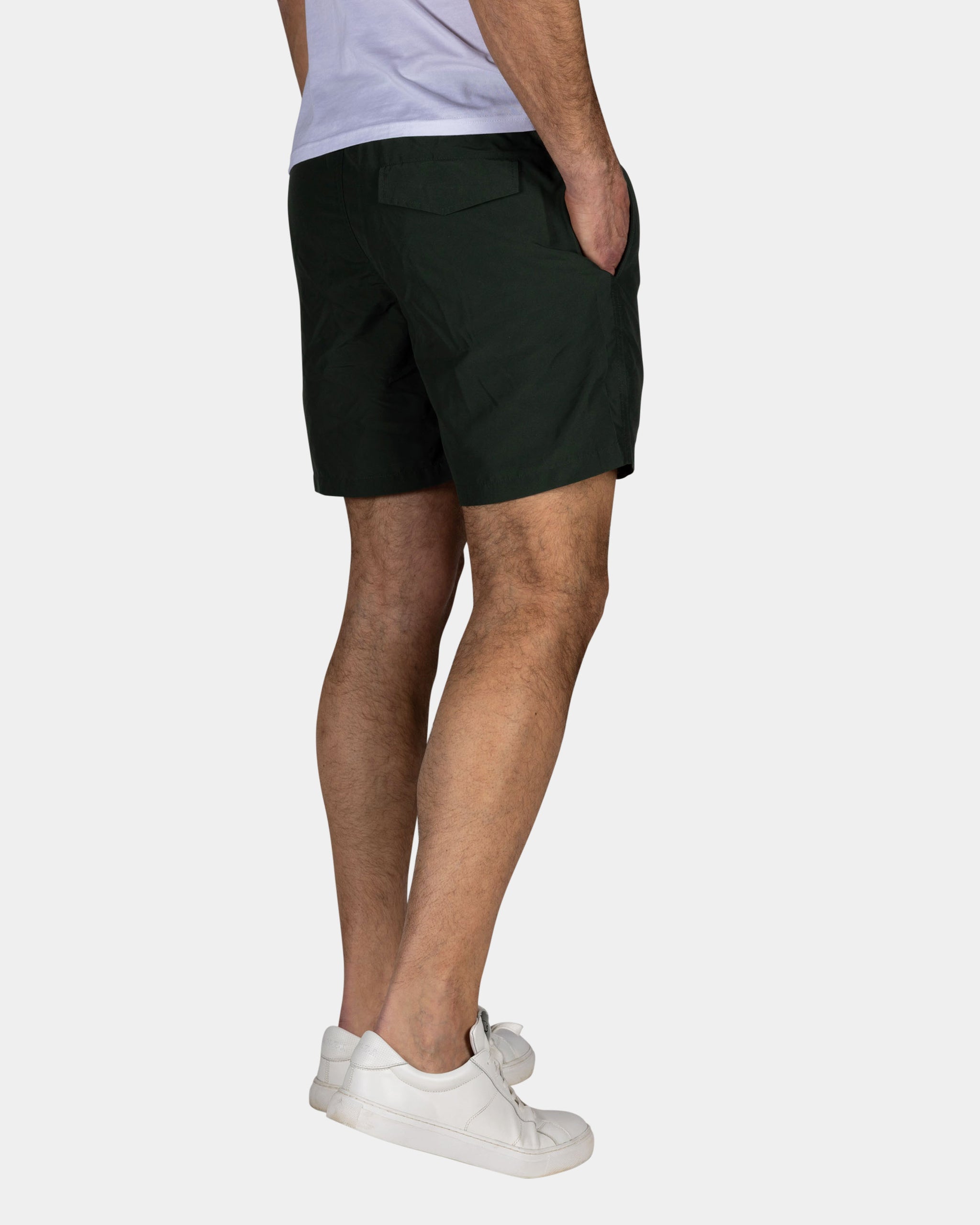 Effen groene zwembroek met groene details Effen groene zwembroek met groene details