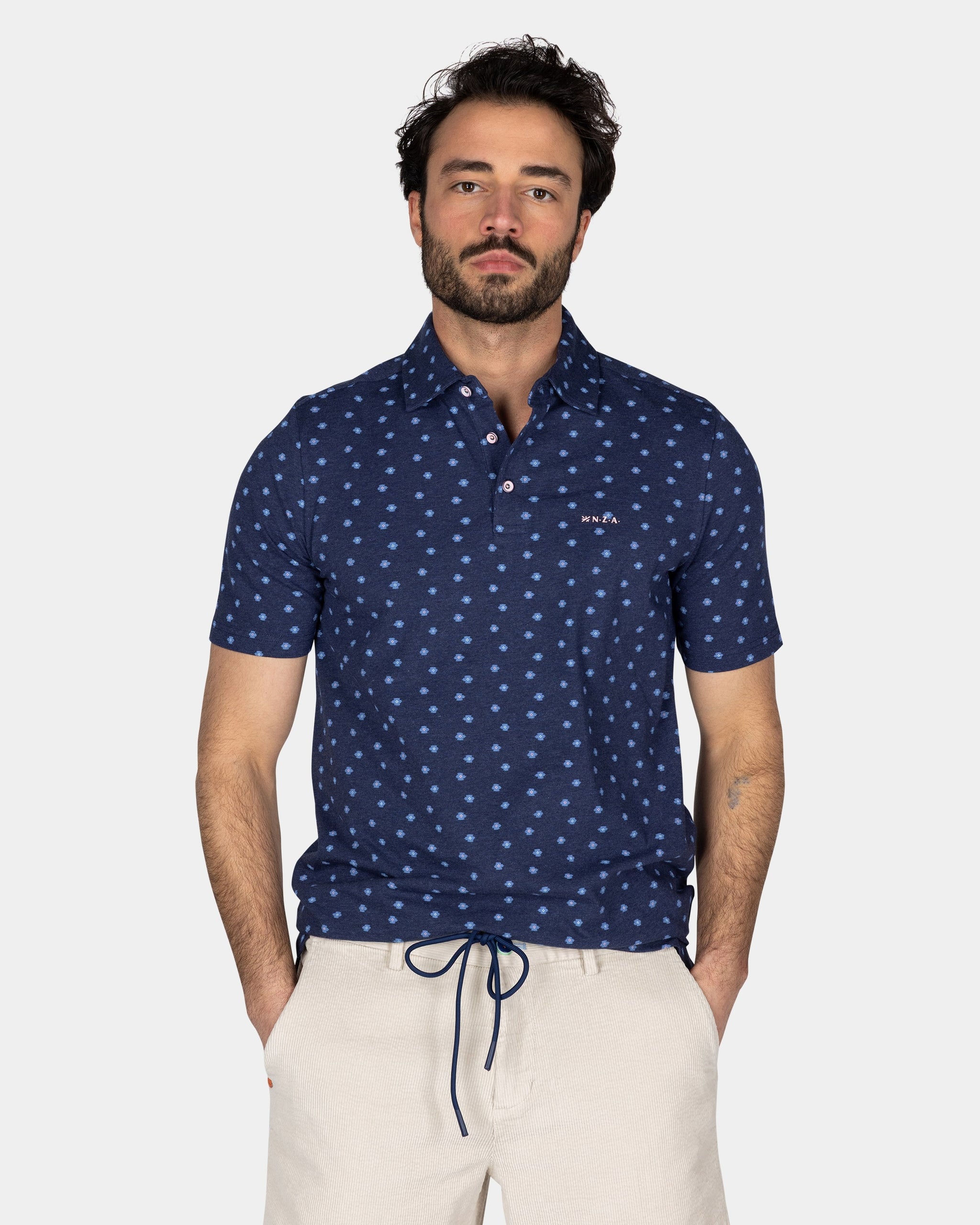 Cotton Blue Polo with a print of small polka dots Cotton Blue Polo with a print of small polka dots