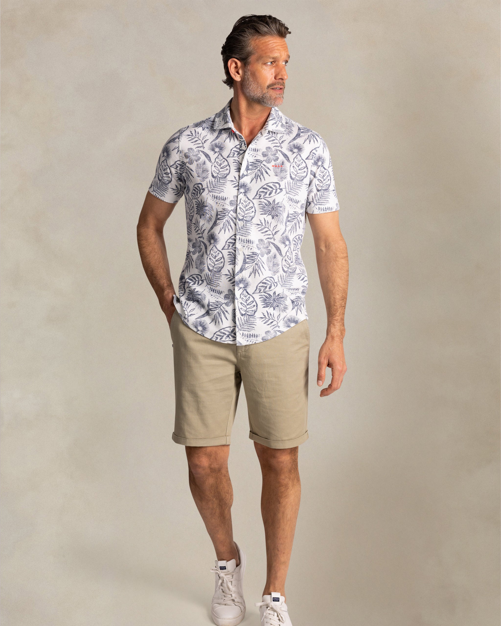 Beige shirt with navy floral print Beige shirt with navy floral print