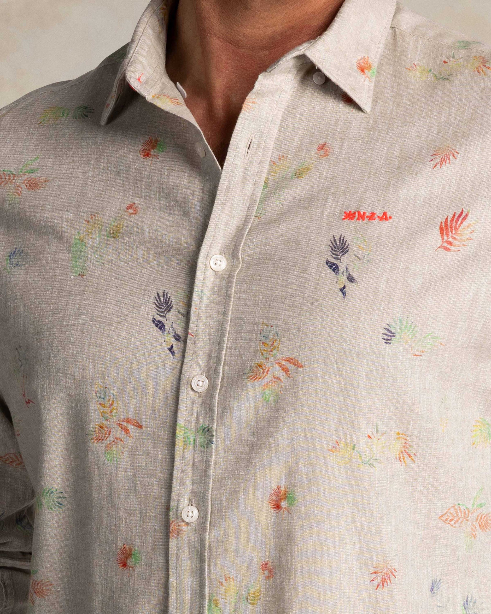 Taupe shirt with colorful floral print Taupe shirt with colorful floral print