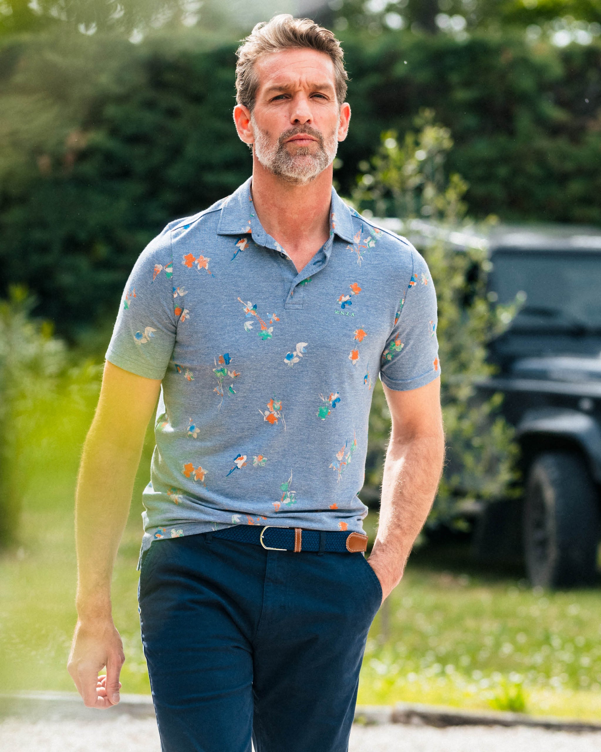 Navy poloshirt met bladprint Navy poloshirt met bladprint