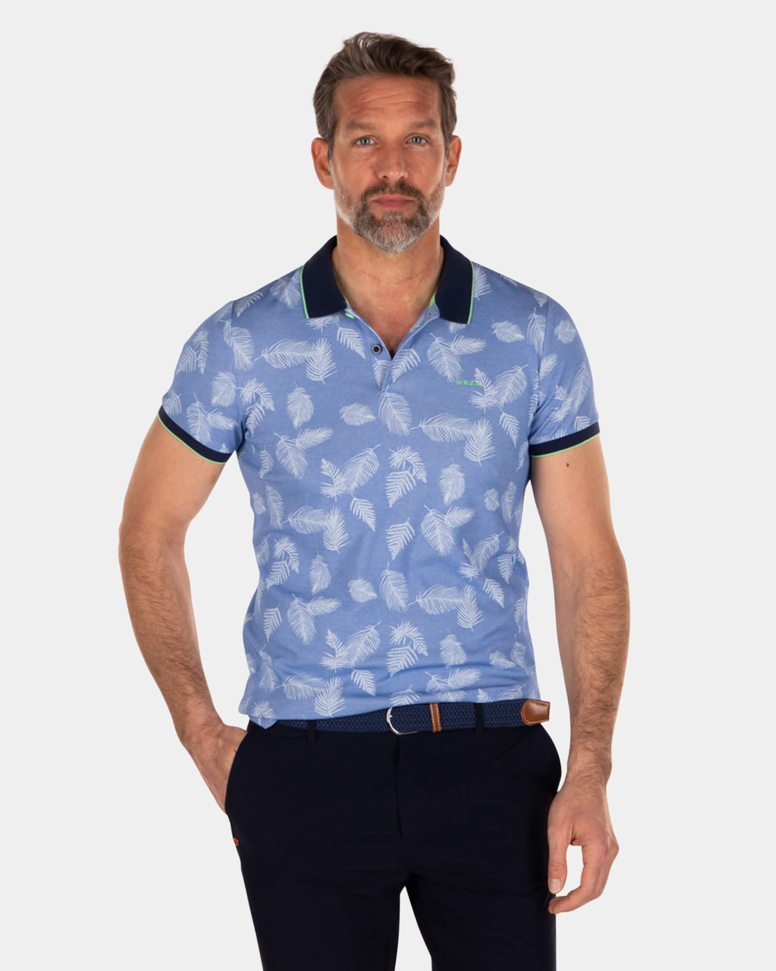 Blaues Poloshirt mit Blattdruck Blaues Poloshirt mit Blattdruck