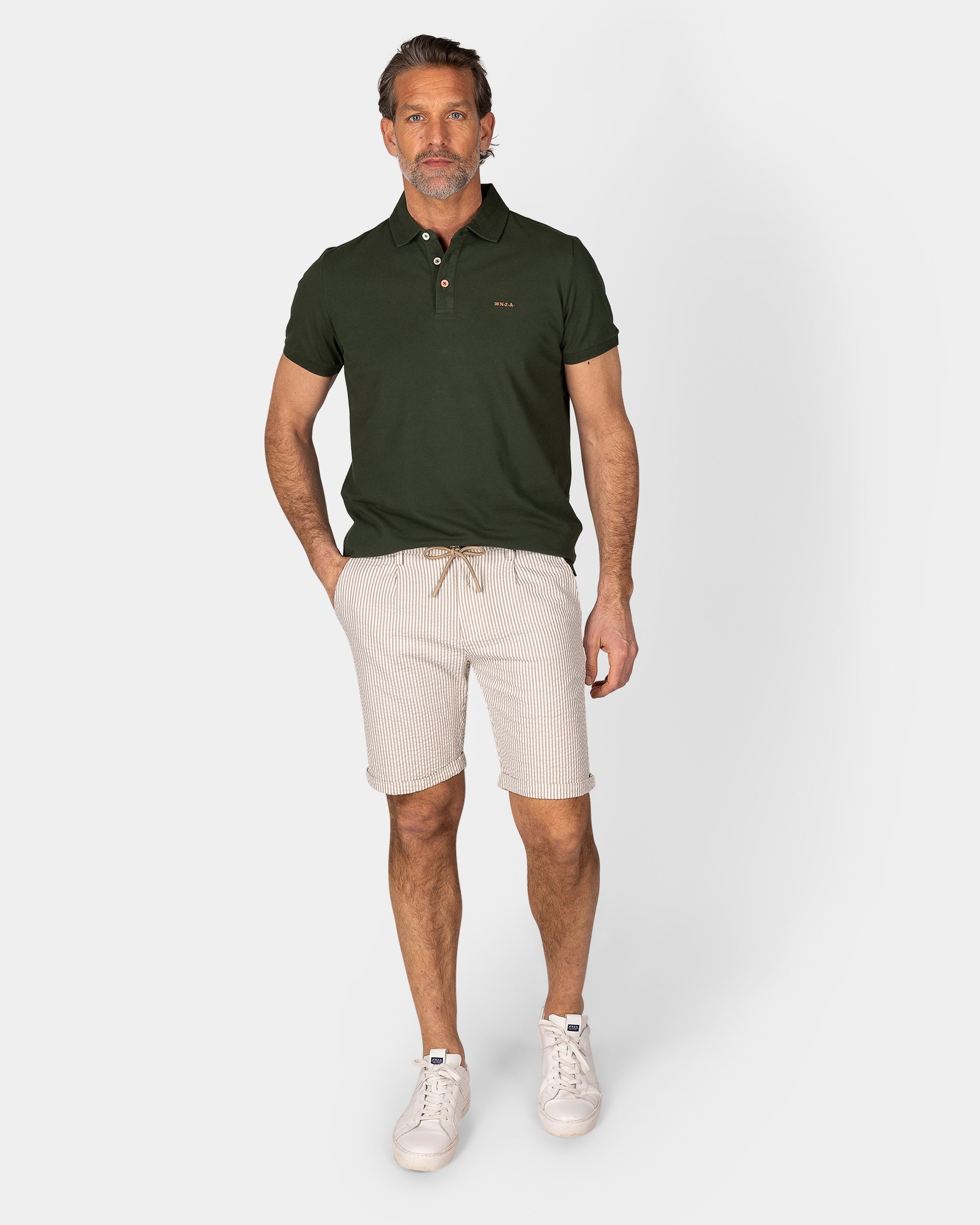 Effen katoenen donkergroene polo Effen katoenen donkergroene polo