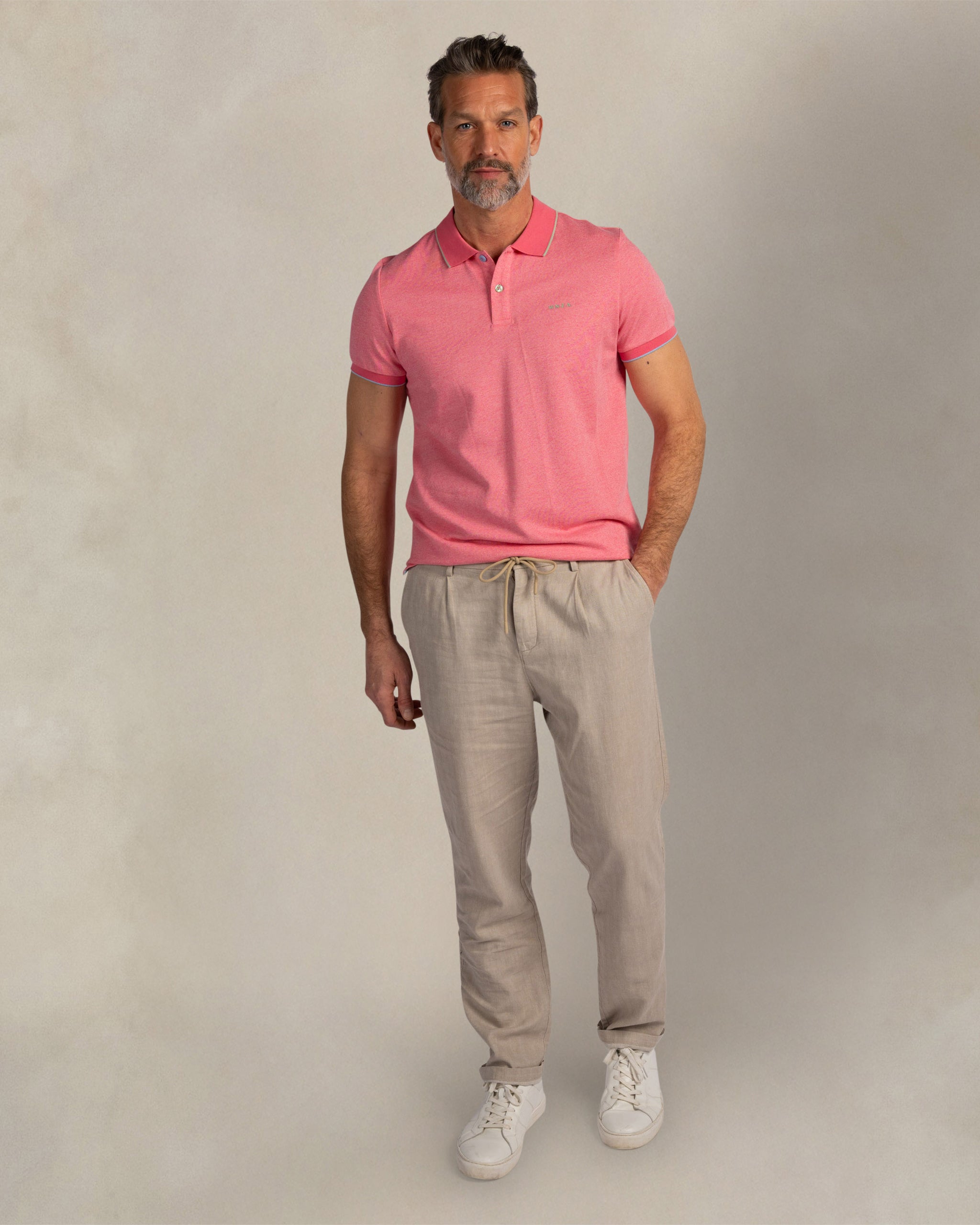 Roze 100% katoenen polo Roze 100% katoenen polo