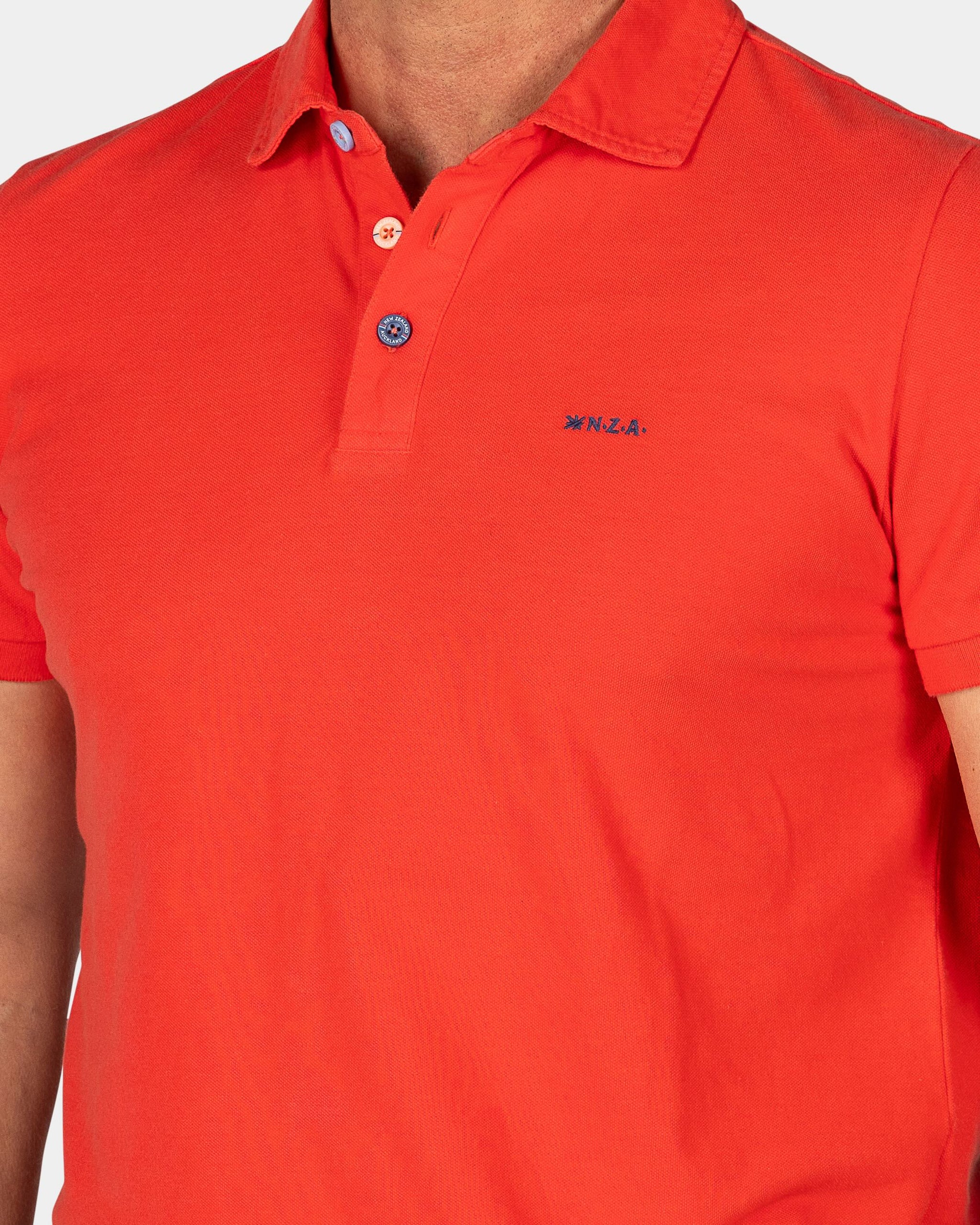 Effen katoenen roodoranje polo Effen katoenen roodoranje polo