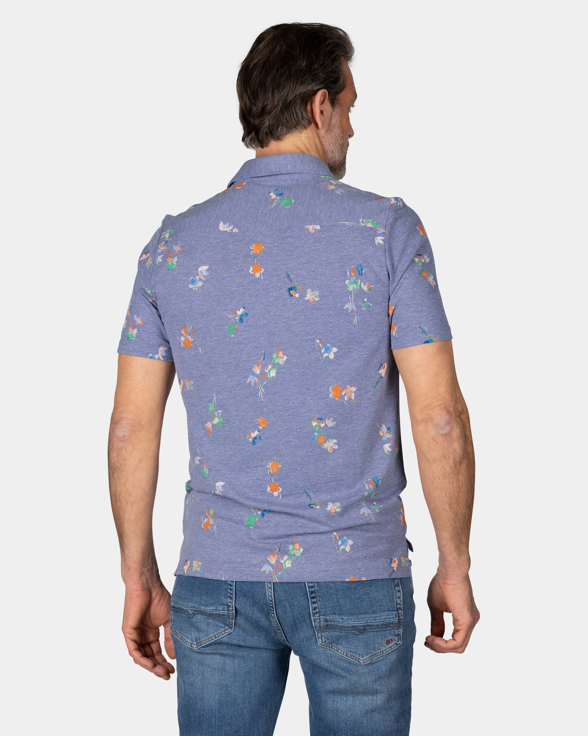 Navy poloshirt met bladprint Navy poloshirt met bladprint