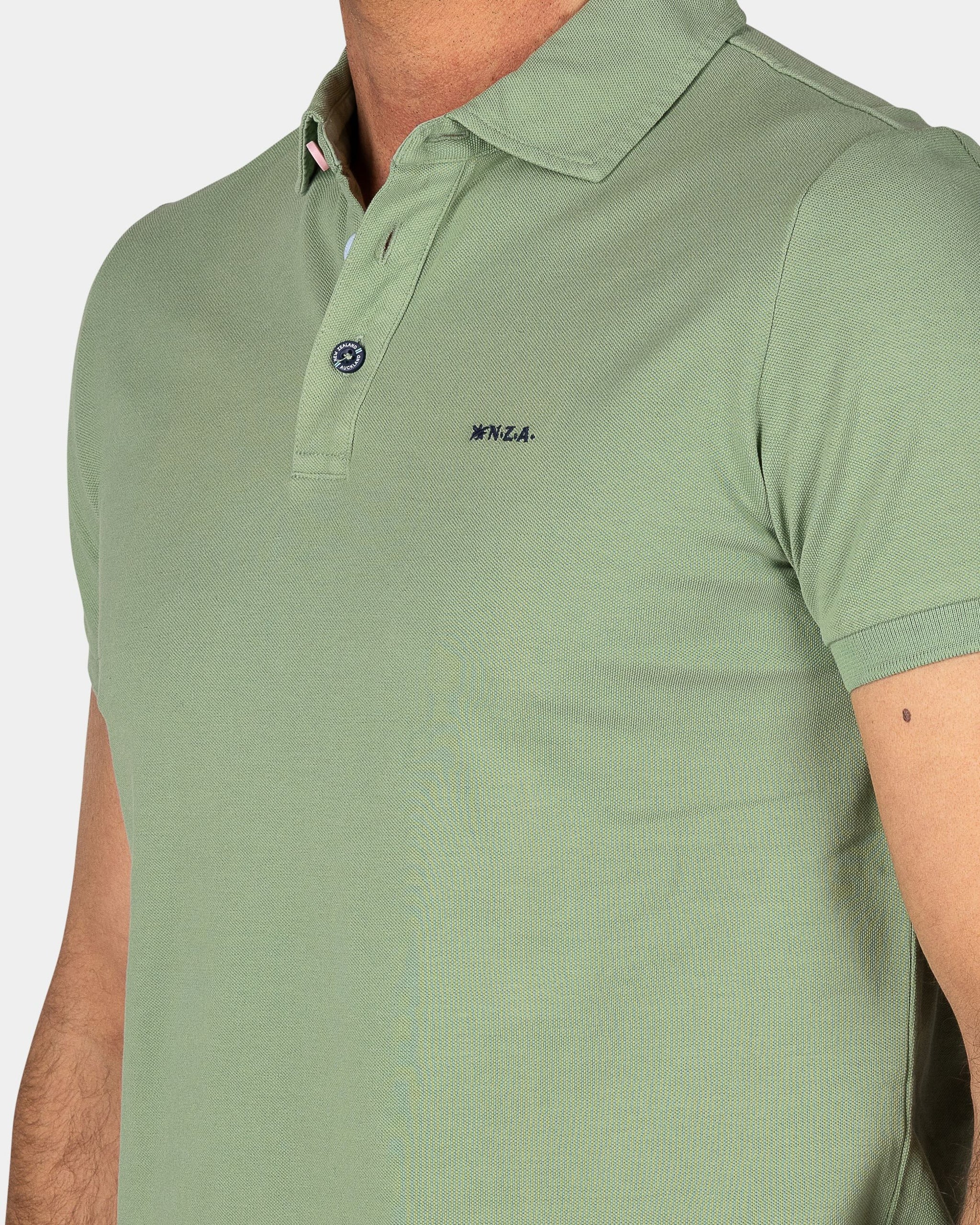 Effen katoenen lichtgroene polo Effen katoenen lichtgroene polo