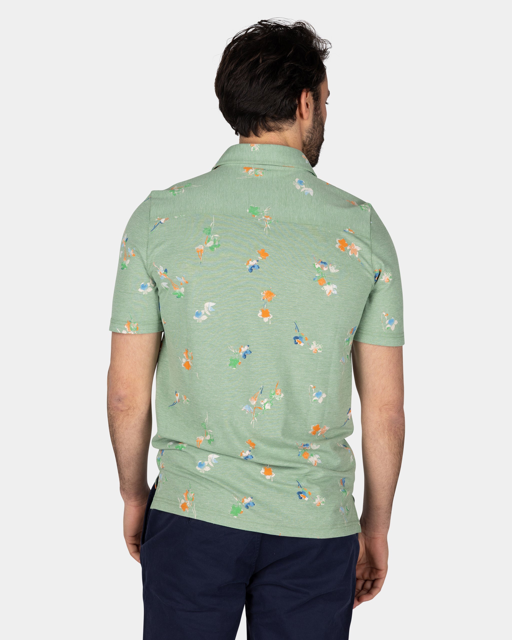 Groen poloshirt met bladprint Groen poloshirt met bladprint