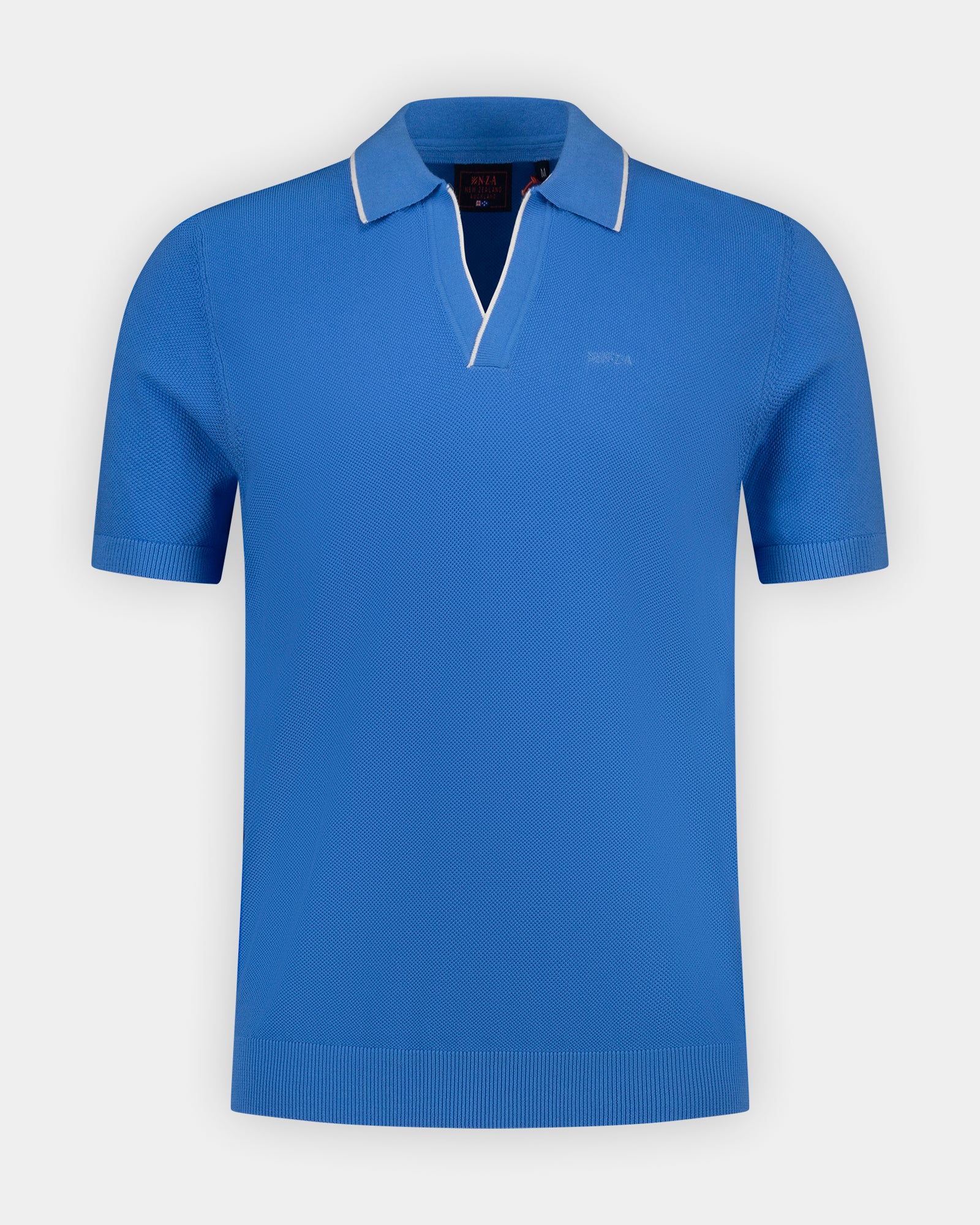 Blauwe gebreide katoenen polo Blauwe gebreide katoenen polo